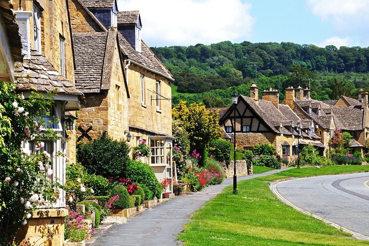 Wander through charming amber-stone cottages adorned with lush gardens where history whispers from every corner inviting travelers to experience the delightful serenity of the Cotswolds.